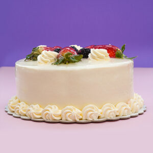 Whipped Cream Blossom Birthday Cake with Vibrant Fruit Accents