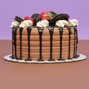 Indulgent Delight: Mocha Cream Birthday Cake with Decadent Chocolate Sauce
