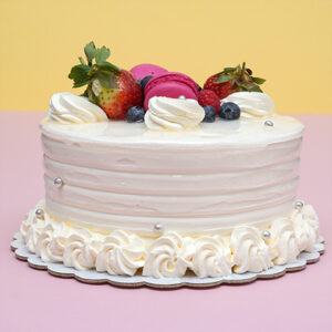Whimsical Wonderland: Vanilla Birthday Cake with Creamy Frosting and Floral Decor