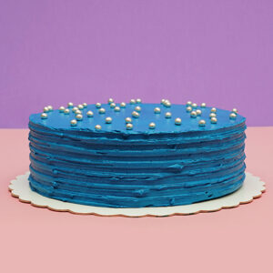 Oceanic Elegance: Vanilla Birthday Cake with Blue Cream Frosting and Chocolate Pearl Decor